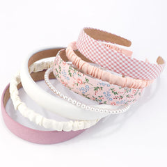 Diadema AHONEY rosa con nudo, añade estilo sin esfuerzo.