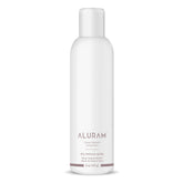 ALURAM Brume texturante sèche, bouteille montrant volume naturel et texture.