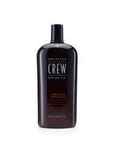 American Crew Gel pour cheveux, bouteille visible, offre une tenue ferme et brillante.