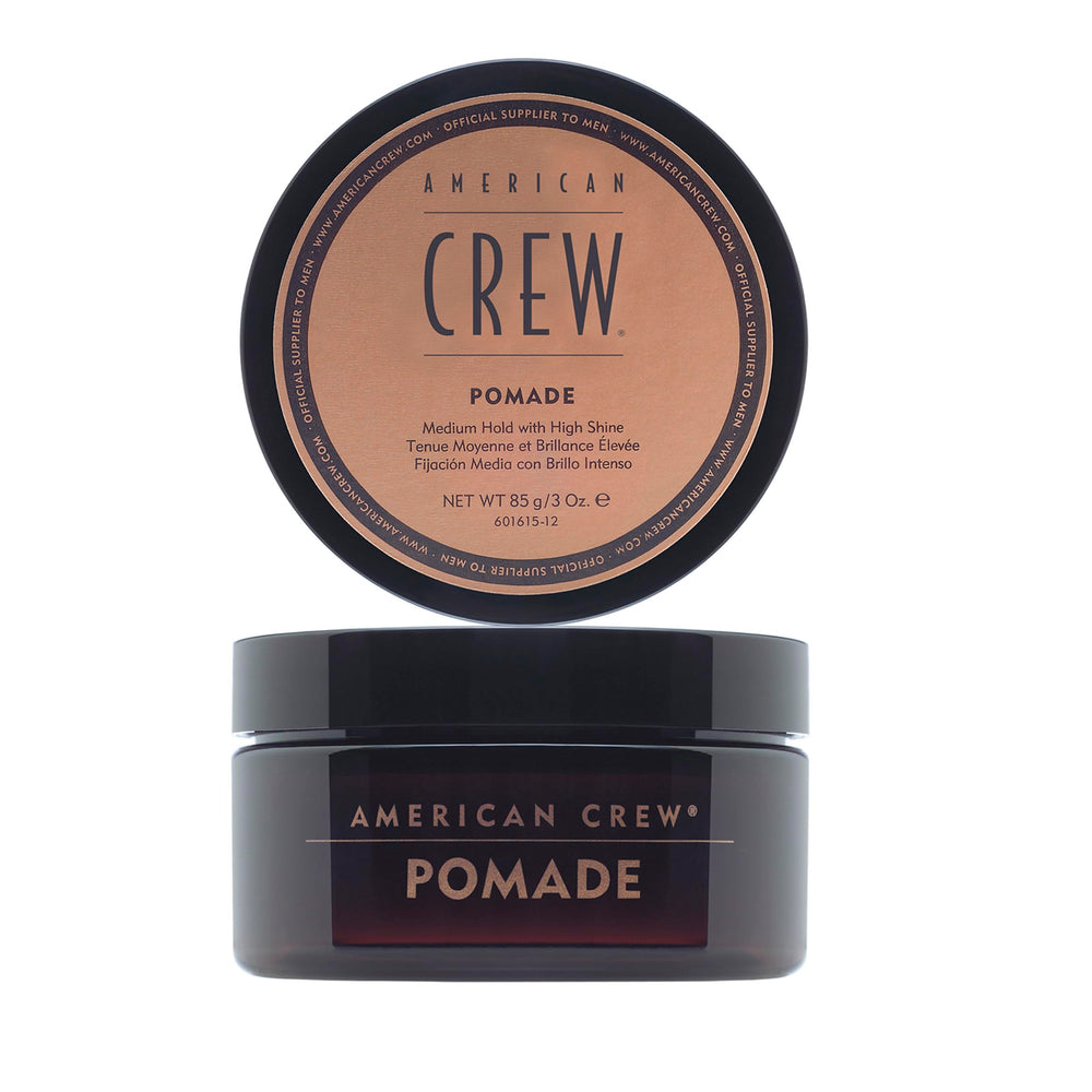 American Crew Hair Pomade bottle for sleek, high-shine styling with medium hold.