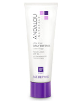 Andalou Naturals crema facial antienvejecimiento SPF 18, botella frontal para protección diaria.