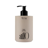 ANILLO shampoo nutritivo: botella vertiendo, aplicación suave y rápida hidratación