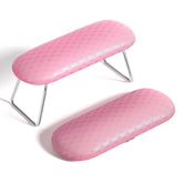 Reposabrazos AORAEM para uñas rosa ofrece soporte cómodo para sesiones de manicura.