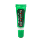 Bag Balm Original, aplicación en labios para hidratación suave y duradera.