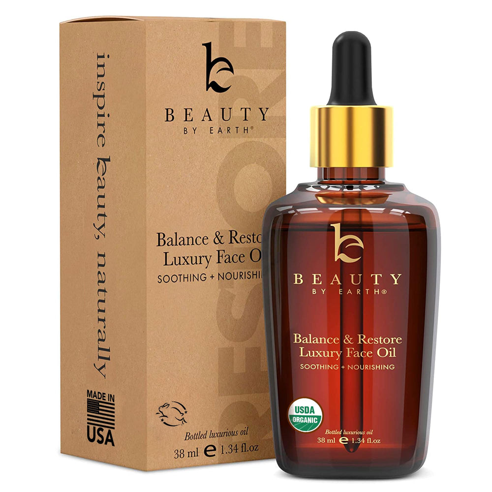 Beauty by Earth: botella de Aceite Facial Balance & Restore para piel equilibrada y suave.