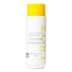 Beekman 1802 Lait Thérapie Peptide Conditionneur – bouteille en gros plan promet douceur et brillance.