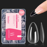 Beetles Gel Nail Tips: puntas transparentes en almendra para un acabado natural.