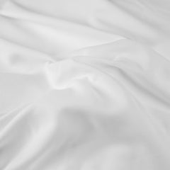 Body Linen Tranquilidad funda para rostro sobre reposacabezas durante masaje.