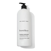Acondicionador Bondbar para cabello dañado, textura cremosa que aporta suavidad.