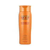 Champú crema Cantu con manteca de karité, frasco visible para nutrición profunda.