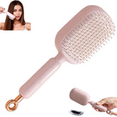 Cepillo auto-limpiante para cabello con cojín ajustable y masaje suave.