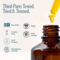 Cliganic Aceite de Jojoba, detalle de vidrio y color dorado natural.