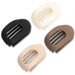 clips-pelo-plano-negro-frente: clip plano negro con agarre seguro para uso diario.
