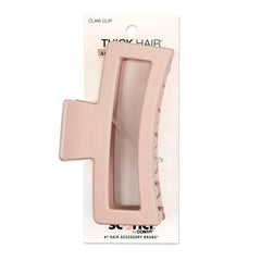 Pinza Scúnci para cabello grueso en rosa suave, agarre seguro para peinados.