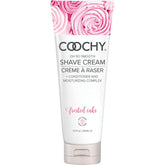 Coochy Shave Cream Frosted Cake, frasco visible para hidratación suave durante el afeitado.