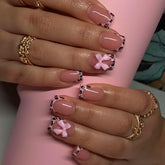 CTTHNBD uñas frances leopard con lazo rosa para un look elegante y rápido
