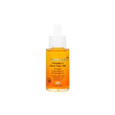 Derma E Vitamina C Brillo facial en botella, iluminación suave.