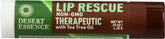 Desert Essence Lip Rescue terapéutico con aceite de árbol de té en envase, para labios secos.
