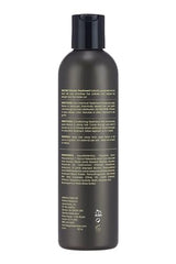 Design Essentials Restore aplicándose en cabello mojado para suavidad y manejabilidad