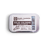 Duke Cannon Old Glory solid cologne tin front, portable fragrance for on-the-go refreshment.