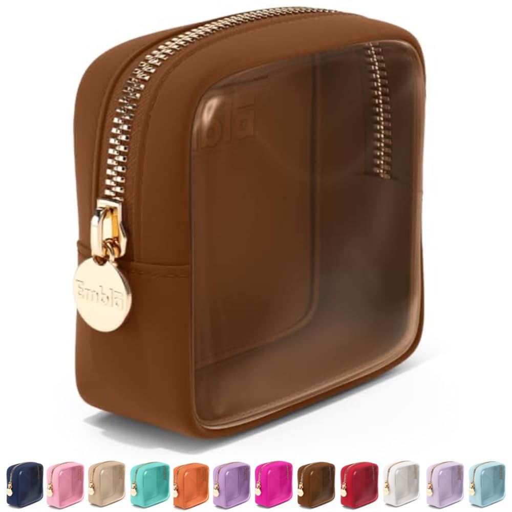 Embla bolsa cosmética transparente con cierre dorado para viajar con estilo