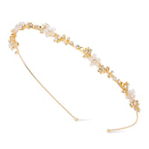 Diadema dorada Exacoo con flor y cristales, perfecta para novias que buscan elegancia.