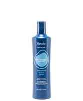 Fanola Wonder Sin Naranja: botella azul neutralizando tonos cálidos en cabello tratado.