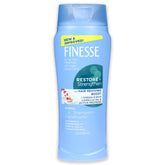 FINESSE dos en uno: botella vertiendo, cabello suave y manejable