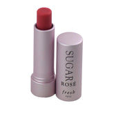 Fresh Sugar Lip Treatment SPF 15 Rose 4.3g bottle closeup, hydrating lip care with rosy tint.