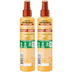 Garnier Whole Blends Honey Milk se aplica en cabello húmedo para peinar.