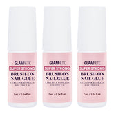 Glamnetic three-bottle brush-on nail glue set, compact and organized.