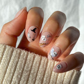 Glamnetic Hogwarts nails with wand and snitch for magical daily wear.