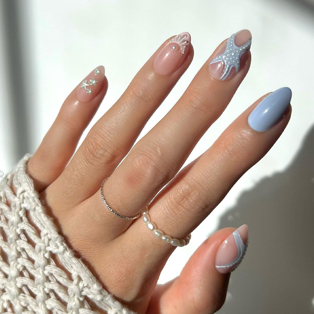 Glamnetic Salty Waves nails with pastel ocean tones for a beach-ready look.