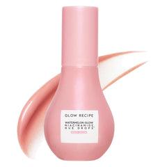 Botella Glow Recipe Hue Drops se vierte para mostrar acabado iluminador rosado.