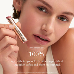 Goop Beauty Tinted Lip Balm on lips shows subtle color and hydration.