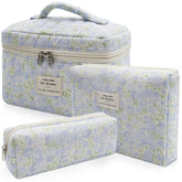 Bolsos grandes acolchados Gosect con flor; ideal para viajar con cosméticos.