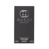 Gucci Guilty para hombre, frasco detalle, aroma sofisticado para uso diario.