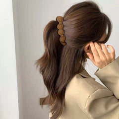 Clip Hapdoo estilo retro 80s/90s para looks divertidos.