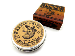 Honest Amish Original Beard Wax container close-up showing creamy texture.