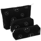 Bolsas Huhumy de maquillaje en pana negro con sonrisas para viajar y organizar.
