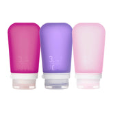 humangear GoToob+ botella rosada para viaje, ideal para líquidos de aseo en cabina.