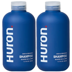 Champú Huron para hombres en botella con fragancia cítrica y madera que revitaliza el cabello.