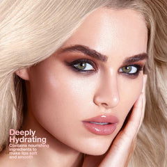IATMOMOD Honey tinted lip balm swatch highlights sheer, natural color.