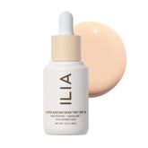 ILIA Super Serum Skin Tint SPF 40 en bote de 30 ml, hidratación ligera y tono natural.