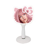 Miroir LED Hello Kitty d'Impressions Vanity en main, éclairage net pour maquillage précis.