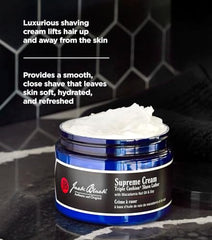 Applying Jack Black Supreme Cream Triple Cushion with a brush for even coverage.