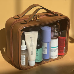JAZD neceser transparente con doble compartimento para organizar cosméticos y accesorios.