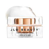 Crema de ojos JLO BEAUTY para aplicación suave y humectante.
