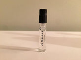 Jo Malone Pera y Fresia, frasco mini para llevar, aroma suave durante el día.