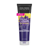 Champú Violet Crush de John Frieda en botella para neutralizar tonos amarillos.